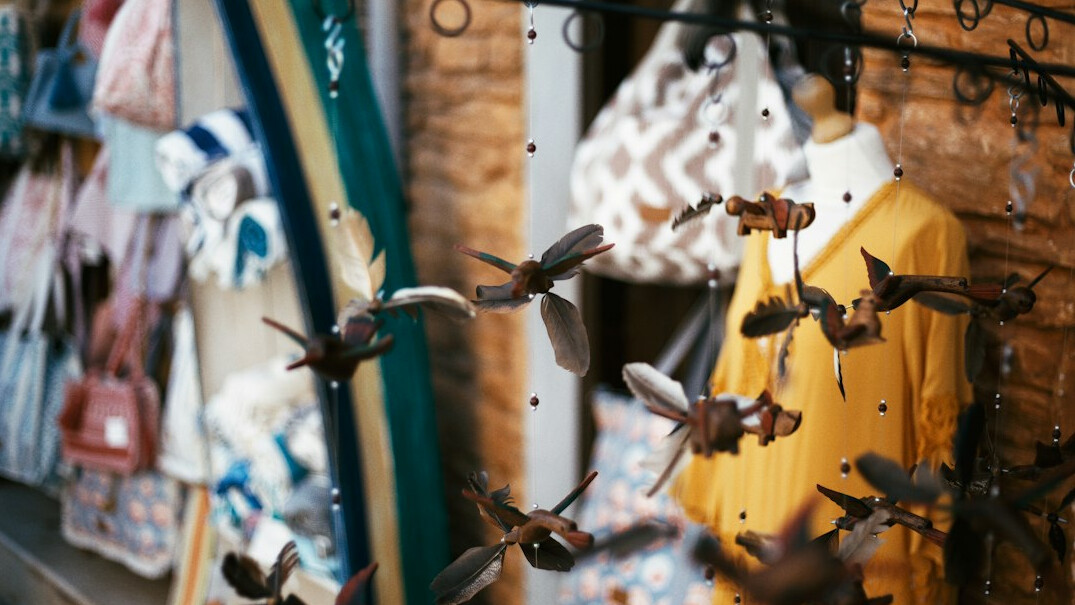 Fashion clothes on hangers in a boutique