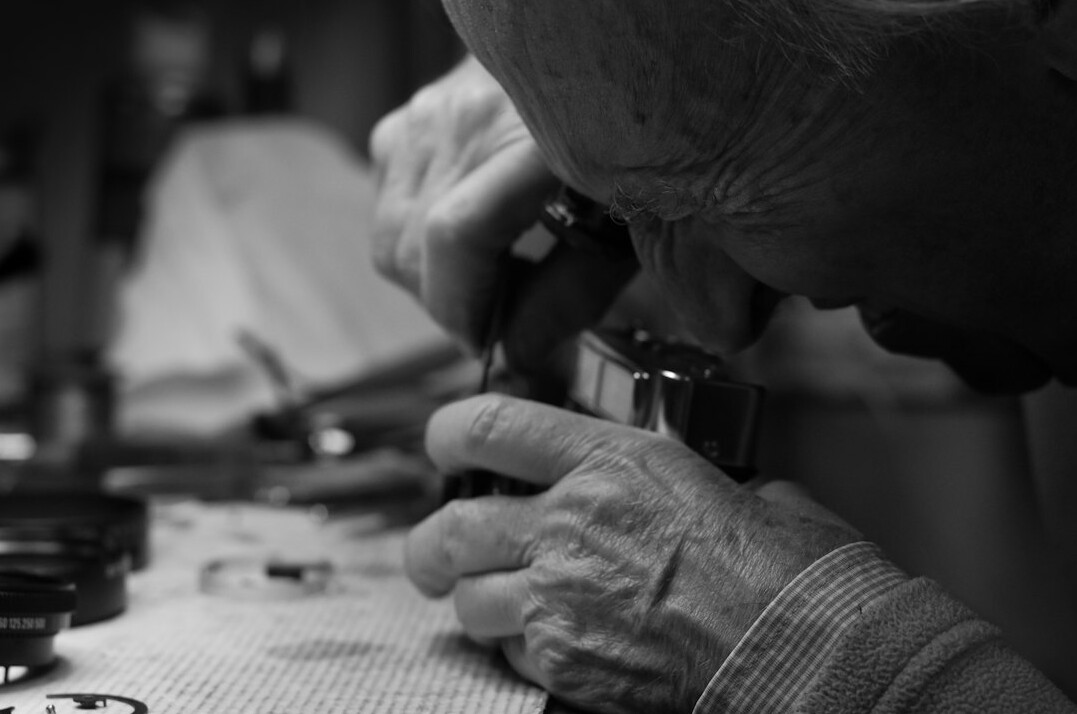 person examining antique