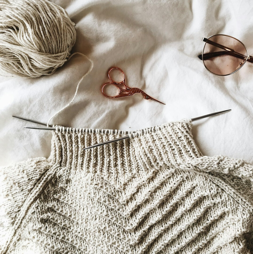 person knitting sweater